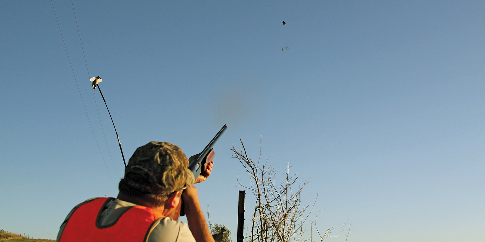 Hunter Shooting at Flying Dove